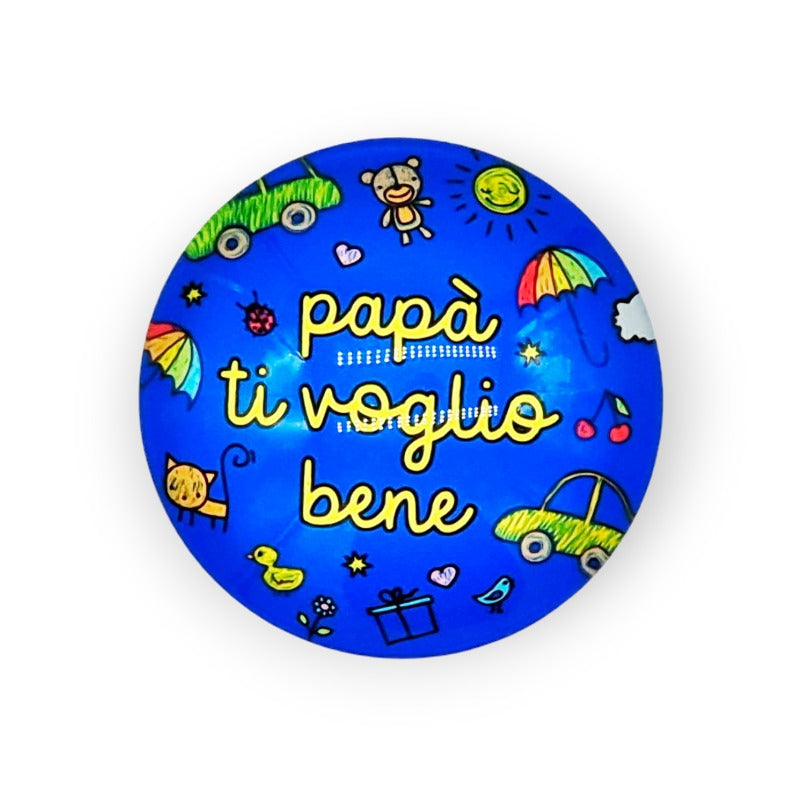Calamita regalo rotonda per la festa del papà. Sfondo colore blu con la scritta "Papà ti voglio bene" Gialla.