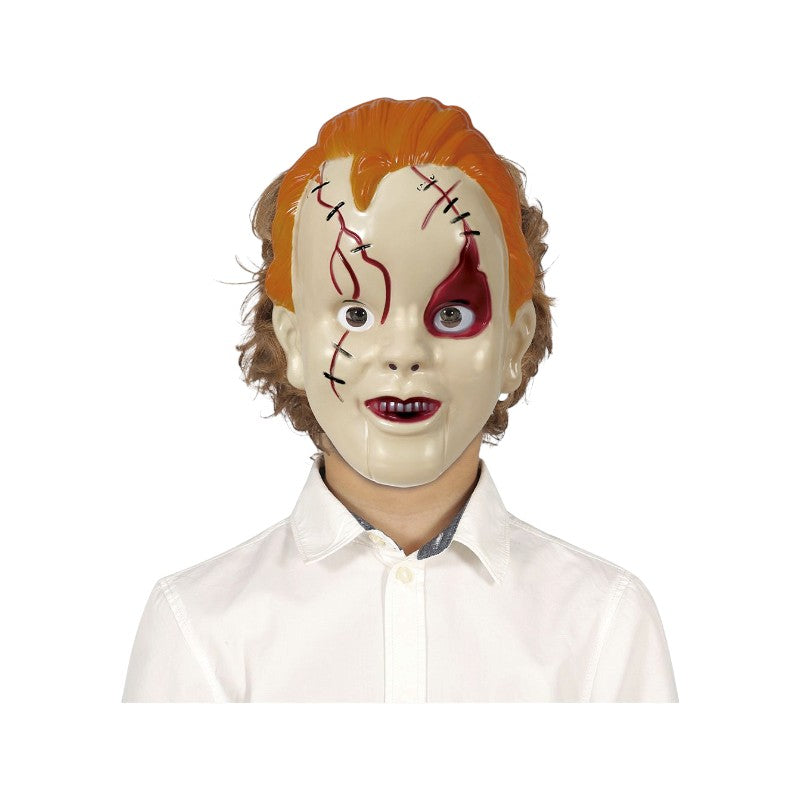 Maschera di Halloween bambola diabolica con capelli rossi e cicatrici cucite: travestimento horror per feste e Carnevale. Su Viano Shop!