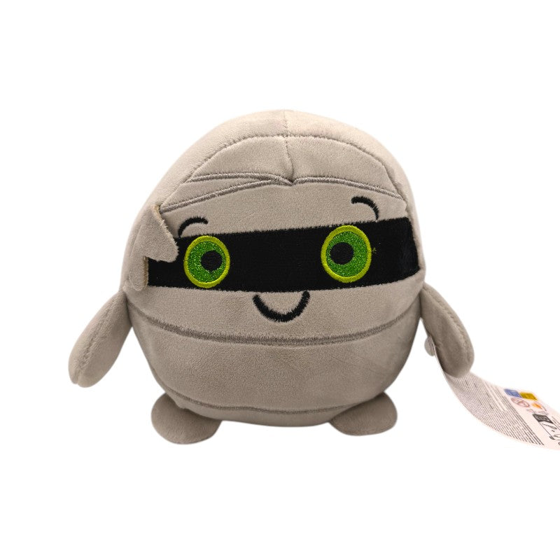 Peluche Halloween Mummia 17x22cm: design kawaii con bende e occhietti glitterati, morbido e coccoloso. Il pupazzo perfetto per Halloween!