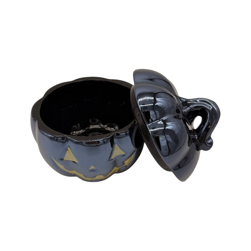 Barattolo zucca di Halloween nero lucido con coperchio e viso dorato: contenitore portacaramelle elegante e decorativo. Su Viano Shop!