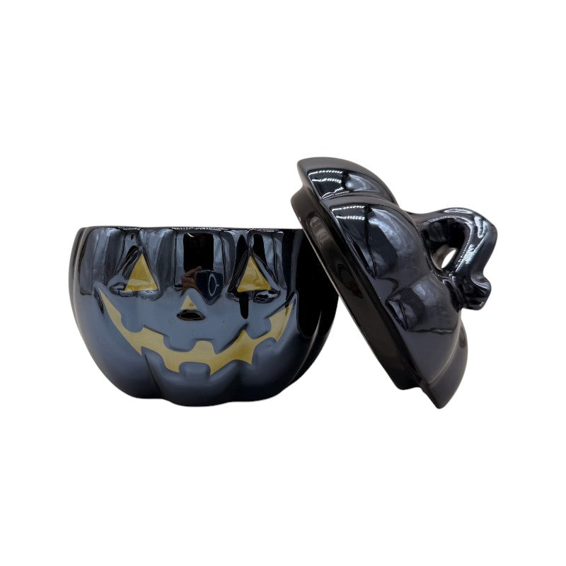 Barattolo zucca di Halloween nero lucido con coperchio e viso dorato: contenitore portacaramelle elegante e decorativo. Su Viano Shop!
